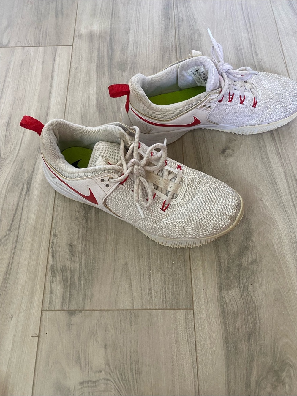 Nike Kids White Sneakers with Red Swoosh Accents